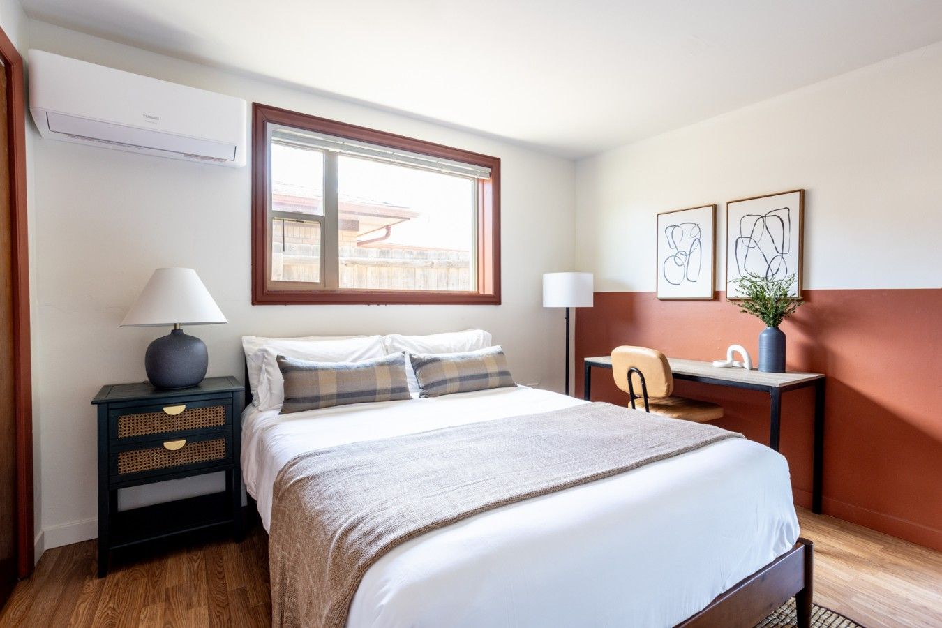 Bedroom with terracotta and white two-tone walls