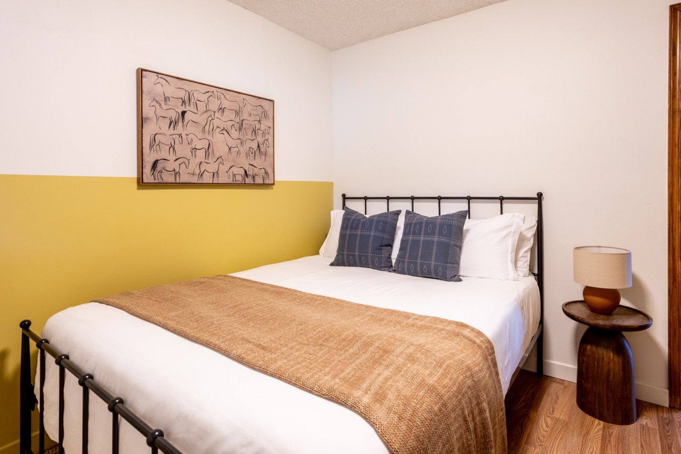 Bedroom with mustard yellow lower wall band